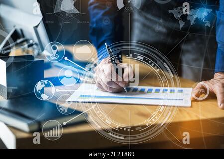 Financial And Marketing Data Analyst Man Looking At Chart Stock Photo