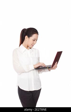 Smiling a young business woman using laptop high quality photo Stock Photo