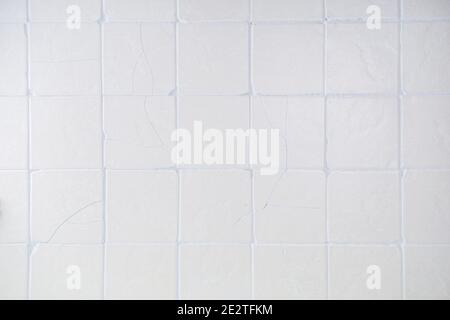 Old kitchen tile wall background. Matte beige cream tiles top view Stock Photo