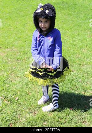 ADANA,TURKEY-APRIL 9:Unidentified Shy little girl with Bee costume posing  at Orange Blossom Carnival.April 9,2017 in Adana,Turkey Stock Photo