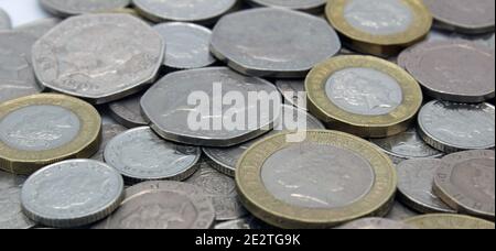 Piles of Great British sterling currency including cash and coins Stock Photo