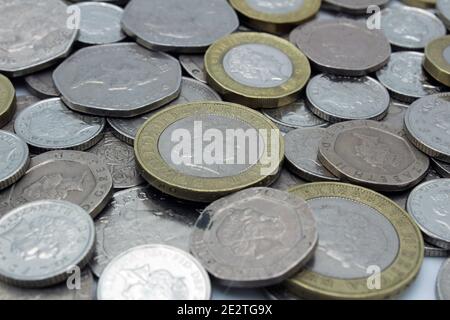 Piles of Great British sterling currency including cash and coins Stock Photo