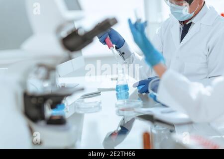 close up. scientists examining liquid samples in the lab. Stock Photo