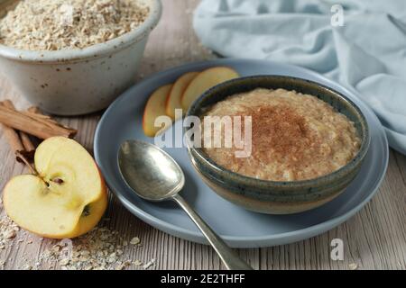 Homemade, healthy organic breakfast of apple and cinnamon porridge Stock Photo