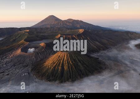 The volcanic peaks of Mount Bromo and Mount Semeru in pat of the Tengger Massif in East Java, Indonesia Stock Photo