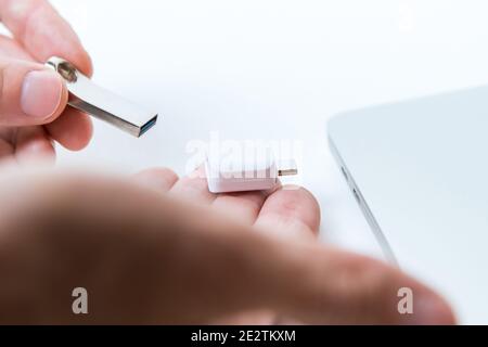 Man uses modern technologies to store memory and digital data Stock Photo