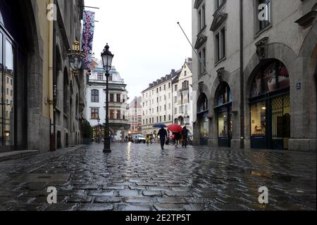 Munich. Bavaria, Germany - April 29th 2019: Landmarks of Munich Hofbrauhaus beer restaurant and Hard Rock Cafe on Platzl square on cloudy evening Stock Photo