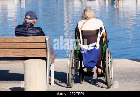 Elderly couple looking at the sea Stock Photo