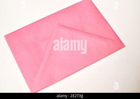 Red closed blank envelope on beige background Stock Photo
