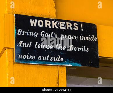 Appeal to the workers in the nutmeg factory in Gouyave, Grenada: Bring God's peace inside and leave the devils noise outside Stock Photo