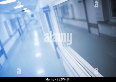 Long hallway of medical building, unfocused background. Stock Photo