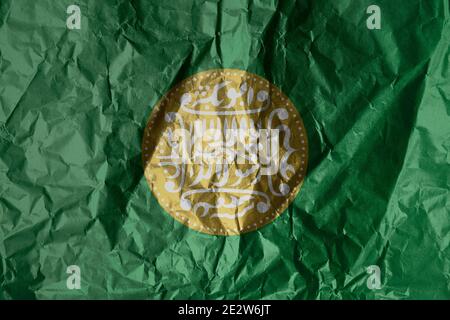 Rohingya flag painted on crumpled paper background Stock Photo