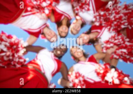Photo of Cheerleaders in Huddle Stock Photo