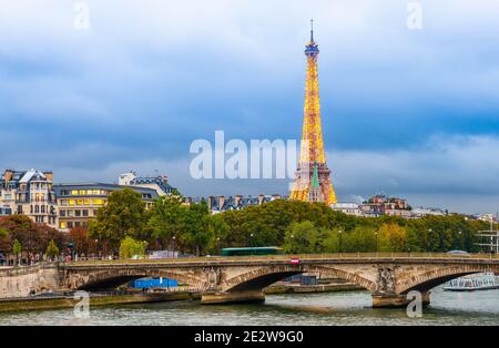 The Eiffel Tower seen from the Alexandre III bridge over the Seine at dusk in Paris in Ile de France, France Stock Photo