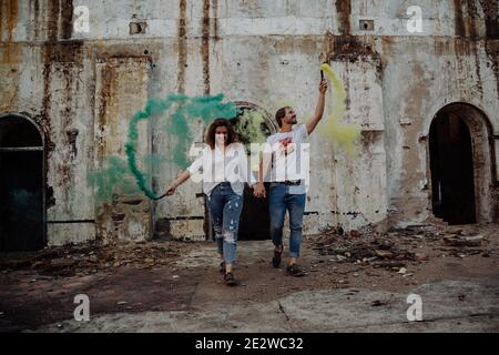 Couple with smoke flares. Concept of love. Stock Photo