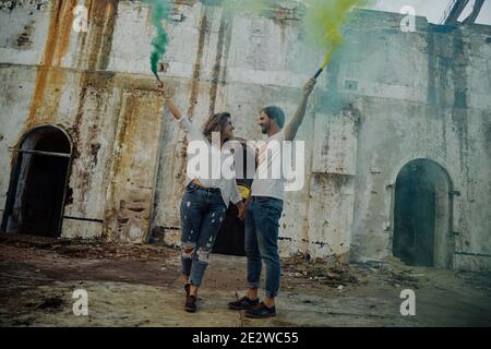 Couple with smoke flares. Concept of love. Stock Photo