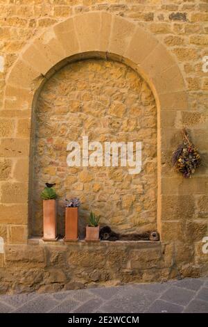 A blocked window in the historic centre of the medieval town of Monticchiello near Pienza in Siena Province, Tuscany, Italy Stock Photo