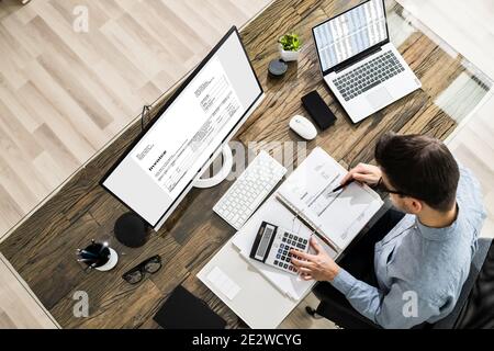 Chartered Tax Accountant Using Modern Invoice Billing Software Stock Photo