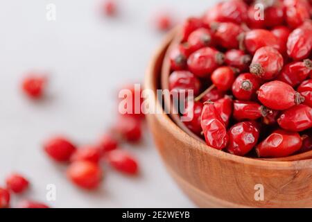 Composition of dog rose on a grey stone background Stock Photo