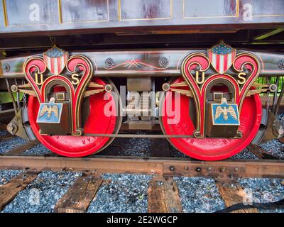 Antique Passenger Train Wheels in Red Blue and Gold Stock Photo