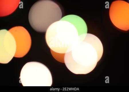 bokeh colorful lights on black background for overlay Stock Photo