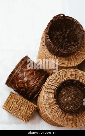 Top view of many natural empty wicker straw cane baskets on white Stock Photo