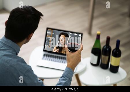 Virtual Wine Tasting Event Party On Laptop Stock Photo