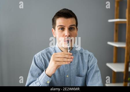 Smoking Electronic Cigarette. Quit Smoking Addiction Or Habit Stock Photo