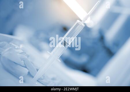 Filled syringe in the hospital ward, concept of drug therapy. Stock Photo