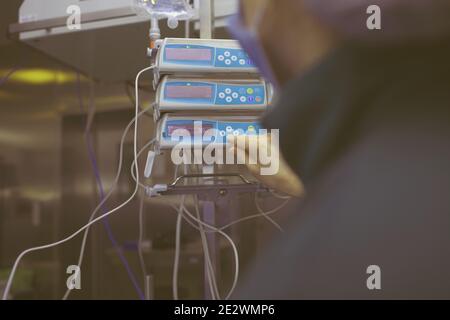Doctor controls technical support during surgery. Stock Photo