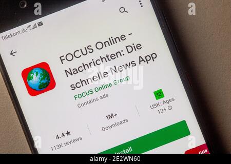 Neckargemuend, Germany: January 15, 2021: app icon of of the German news magazine 'Focus' in the google app store on phone screen top view, Illustrati Stock Photo