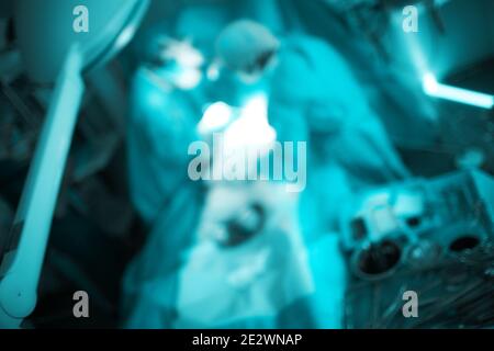 Team of working doctors, unfocused background. Stock Photo