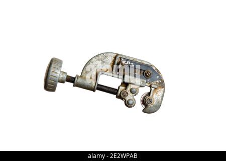 Antique tubing cutter on a solid white background Stock Photo