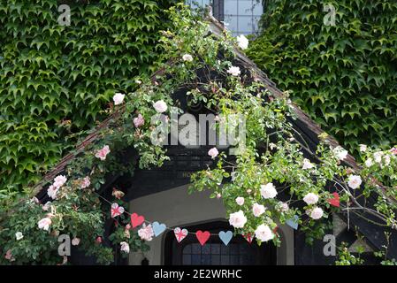 ivy covered porch and wooden heart garland Stock Photo