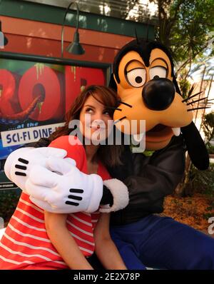 Emmy Award-winning actress Tina Fey, star of 'Date Night' and executive producer of the NBC series '30 Rock,' poses with Goofy at the Sci-Fi Dine-In Theater restaurant at Disney's Hollywood Studios theme park in Lake Buena Vista, FL, USA on April 23, 2010. Fey was visiting Walt Disney World Resort on vacation with her family. Photo by Gene Duncan/Disney via ABACAPRESS.COM Stock Photo