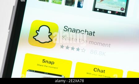Snapchat app page in the App Store on Apple iPhone screen. Snapchat is a multimedia messaging app developed by Snap Inc. Stock Photo