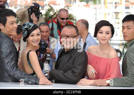 'Chinese director Wang Xiaoshuai (C) poses with Chinese actress Fan Bingbing (2ndR), Chinese actress Li Feier (2ndL), Chinese actors Qing Hao (R) and Chinese actor Zi Yi (L pose during the photocall of the film ''Rizhao Chongqing'' (Chongqing Blues) presented in competiton at the 63rd Cannes Film Festival in Cannes, France on May 13, 2010. Photo by Hahn-Nebinger-Orban/ABACAPRESS.COM' Stock Photo