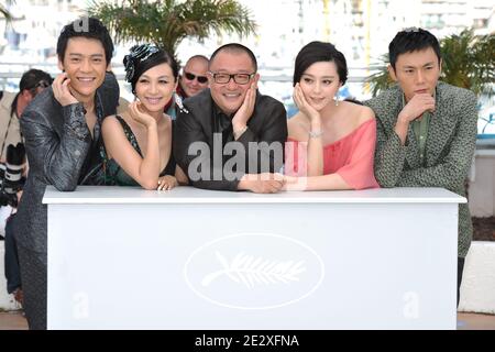 'Chinese director Wang Xiaoshuai (C) poses with Chinese actress Fan Bingbing (2ndR), Chinese actress Li Feier (2ndL), Chinese actors Qing Hao (R) and Chinese actor Zi Yi (L pose during the photocall of the film ''Rizhao Chongqing'' (Chongqing Blues) presented in competiton at the 63rd Cannes Film Festival in Cannes, France on May 13, 2010. Photo by Hahn-Nebinger-Orban/ABACAPRESS.COM' Stock Photo