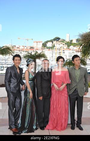 'Chinese director Wang Xiaoshuai (C) poses with Chinese actress Fan Bingbing (2ndR), Chinese actress Li Feier (2ndL), Chinese actors Qing Hao (R) and Chinese actor Zi Yi (L pose during the photocall of the film ''Rizhao Chongqing'' (Chongqing Blues) presented in competiton at the 63rd Cannes Film Festival in Cannes, France on May 13, 2010. Photo by Hahn-Nebinger-Orban/ABACAPRESS.COM' Stock Photo