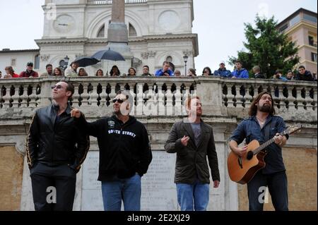 Actors of the movie 'Robin Hood' Russell Crowe (2nd L), Kevin Durand (L), Scott Grimes and Alan Doyle (R) play rock'n roll during an impromptu performance in Rome's Trinita' dei Monti steps (Spanish Steps), Italy on May 15, 2010. Crowe arrived in Rome a decade after starring in the title role of the movie 'Gladiator'. He is fresh off the Cannes film festival where he presented his new movie 'Robin Hood,' directed by Ridley Scott. Photo by Eric Vandeville/ABACAPRESS.COM Stock Photo