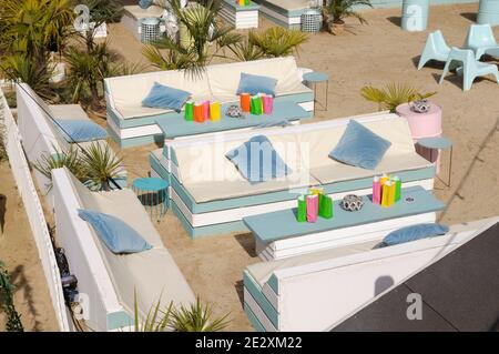 Beach club with contemporary outdoor seating in white and pastel blue, Fulham Beach Club, London, England, UK Stock Photo