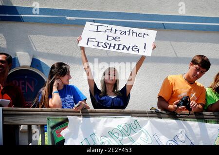 People hold signs as the motorcade of President Barack Obama travels to the Gulf Coast of Louisiana to assess the latest efforts to counter the BP Deepwater Horizon oil spill May 28 2010 in Grand Isle, Louisiana, USA. Photo by Olivier Douliery /ABACAPRESS.COM Stock Photo