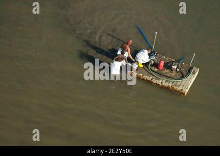 Exclusive Coverage - Aerial view of Workers contracted by BP May 24, 2010 in Elmer Island Louisiana. BP officials indicated on Saturday that the latest attempt to plug the source of the worst oil spill in U.S. history still hasn't been successful. Photo by Richard Shephard /ABACAPRESS.COM Please agree fees prior to usage. Stock Photo