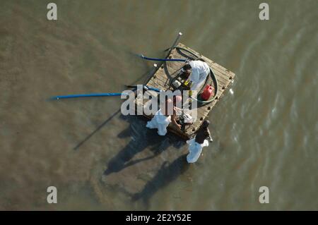 Exclusive Coverage - Aerial view of Workers contracted by BP May 24, 2010 in Elmer Island Louisiana. BP officials indicated on Saturday that the latest attempt to plug the source of the worst oil spill in U.S. history still hasn't been successful. Photo by Richard Shephard /ABACAPRESS.COM Please agree fees prior to usage. Stock Photo