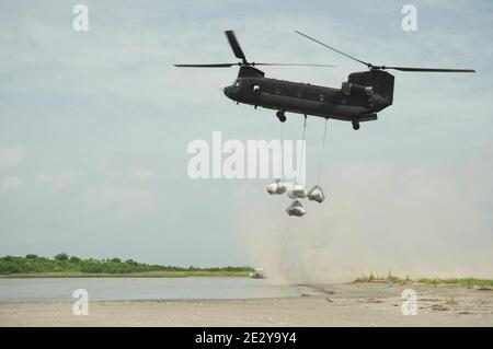 Military helicopters Chinook carry sand-bags to fight the oil spill in Bay Chaland, Louisiana on June 04, 2010. Photo by Richard Shephard/ABACAPRESS.COM Stock Photo