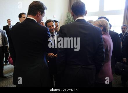 British Prime Minister David Cameron, Canadian Prime Minister Stephen Harper (unseen) US President Barack Obama, French President Nicolas Sarkozy, Russian President Dmitry Medvedev (unseen), German Chancellor Angela Merkel, European Commission head Jose Manuel Barroso, EU president Herman Van Rompuy and French President Nicolas Sarkozy speak during the 2010 (Group of Eight) G8 Summit at the Deerhurst Resort at Muskoka, in Huntsville, Ontario, Canada, on June 25, 2010. Photo by Elodie Gregoire/ABACAPRESS.COM Stock Photo