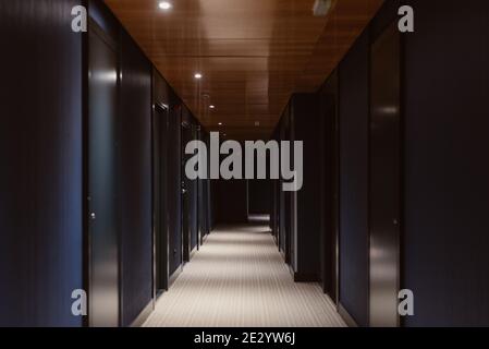 long dark elegant corridor of a luxury hotel Stock Photo