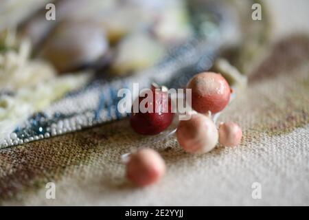 Couture embroidery in mixed technique. Still life with artichokes. Stock Photo