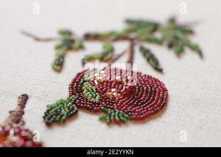 Couture embroidery of pomegranate. Still life with fruits Stock Photo