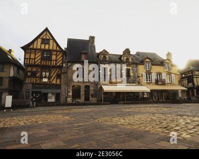 Panorama view of old ancient historic traditional typical half-timbered houses buildings on Bouffay main square in Malestroit Moreac Vannes Morbihan B Stock Photo